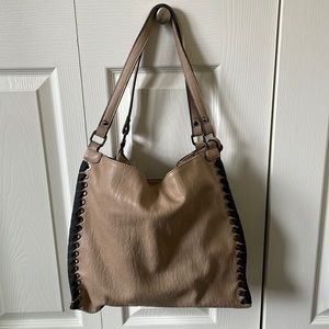 Jessica Simpson camel colored bag with black whipstitch details.